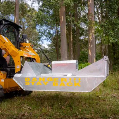 Elgra Engineering: alternative view of two blade slasher attached to a front loader in a forest