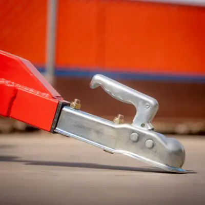Elgra Engineering: A close up of the tow hitch of an orange paddock Cleaner