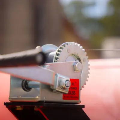 Elgra Engineering: Alternative view of the hand winch of an orange paddock Cleaner