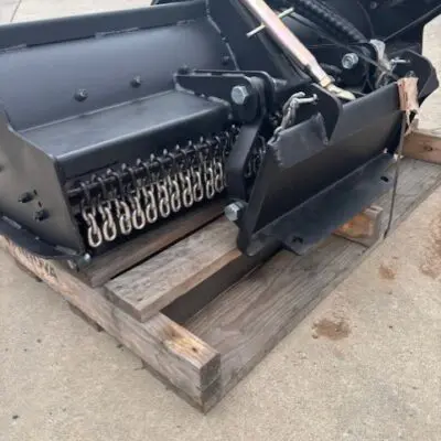 Elgra Engineering: A back side profile image of a Flail Mower on a crate